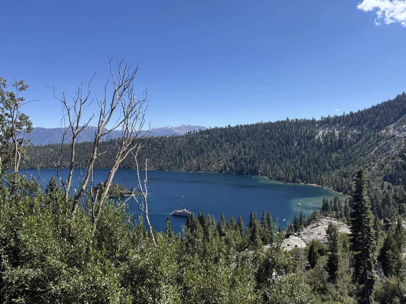 Emerald Bay at Lake Tahoe, surrounded by trees and mountains